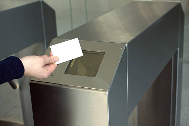 istock Woman's hand puts white access card to reader closeup 500577904