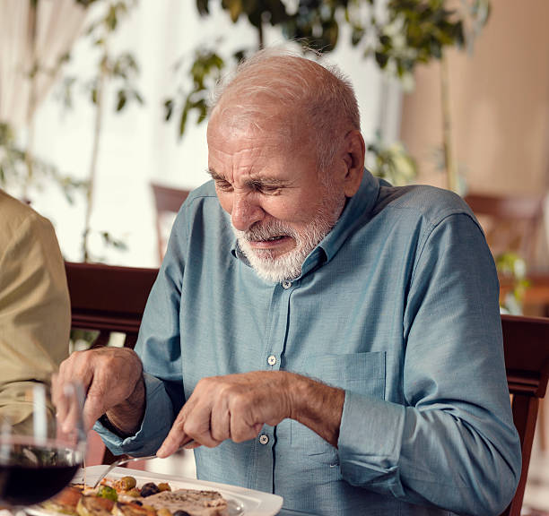 Disgusting Lunch Senior Man Having Lunch awful taste stock pictures, royalty-free photos & images