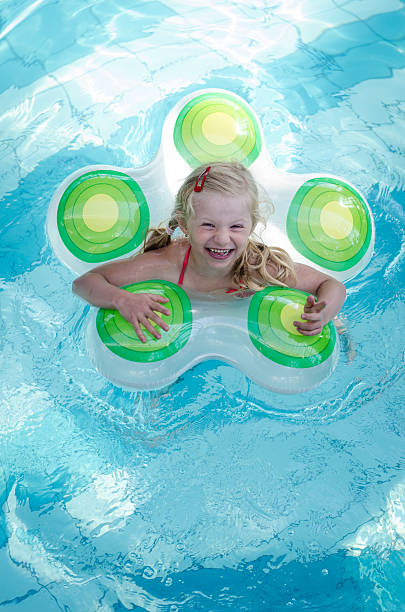istock laughing child in swimming pool 500578306