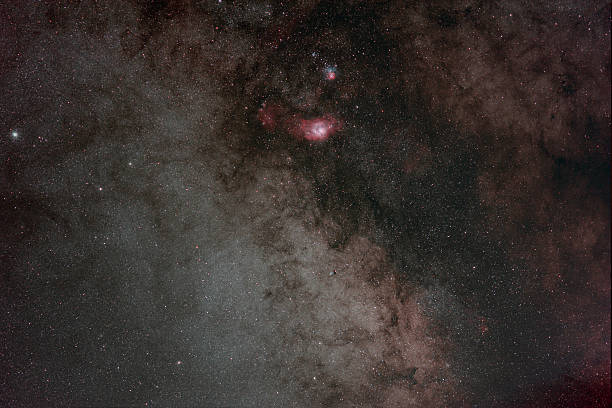 istock M8, The Lagoon Nebula, seen with M20, The Trifid Nebula, 500579129