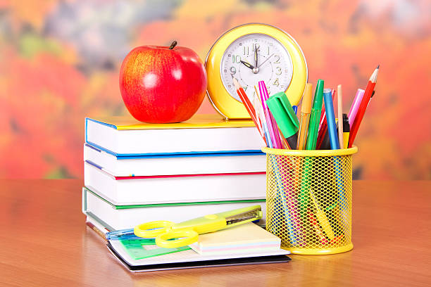 istock Books, alarm clock, pencils and handles 500579861