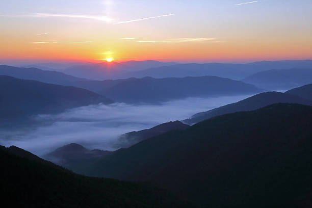 istock mountains in the mist before sun dawn 500589652