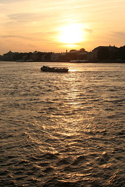 istock pleasure boat floats on the river at sunset 500591832