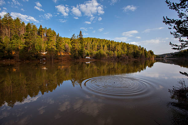 reflection lake es - long exposure rock cloud sky stock-fotos und bilder