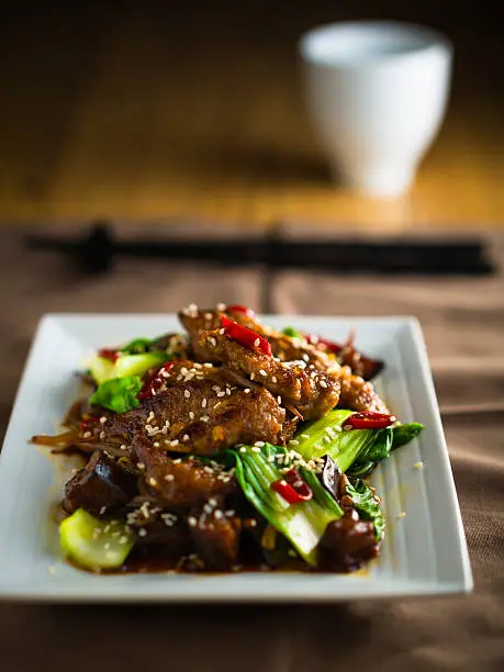 Home made Oriental beef stir-fried with pok choi,aubergine and bean sprouts