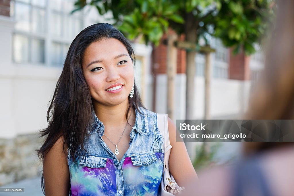 Young asian woman talking with a friend. city life 18-19 Years Stock Photo