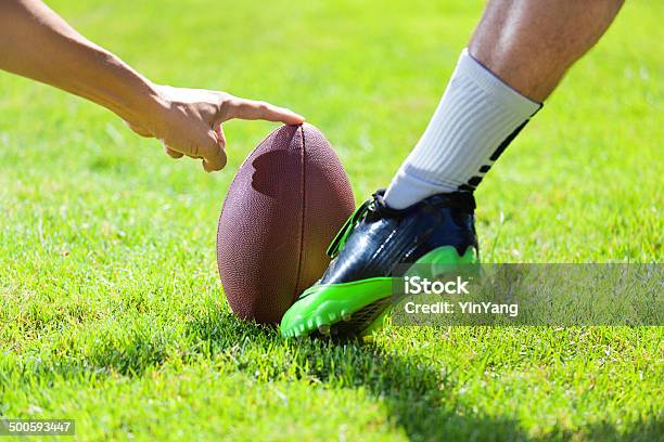 Amrtican Football Player Kicking The Field Goal Stock Photo - Download Image Now - American Football - Ball, Kicking, American Football - Sport