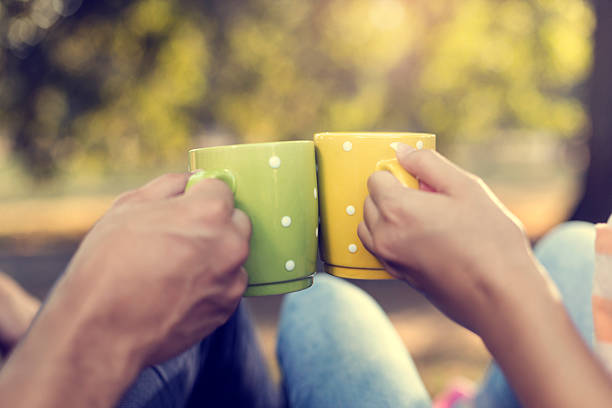 istock Young couple in the park with coffee 500594228