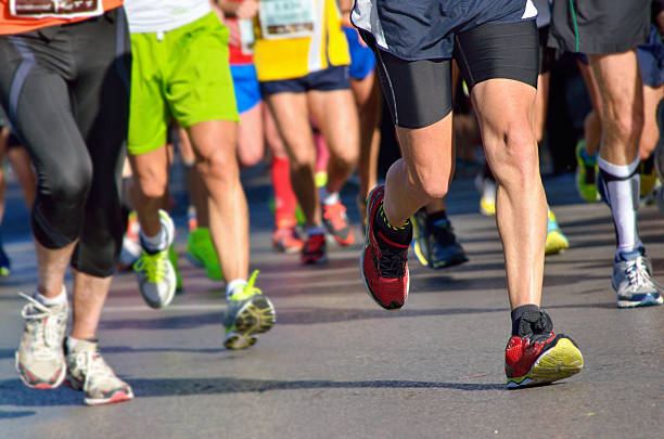 istock Marathon running race, people feet on road 500594229