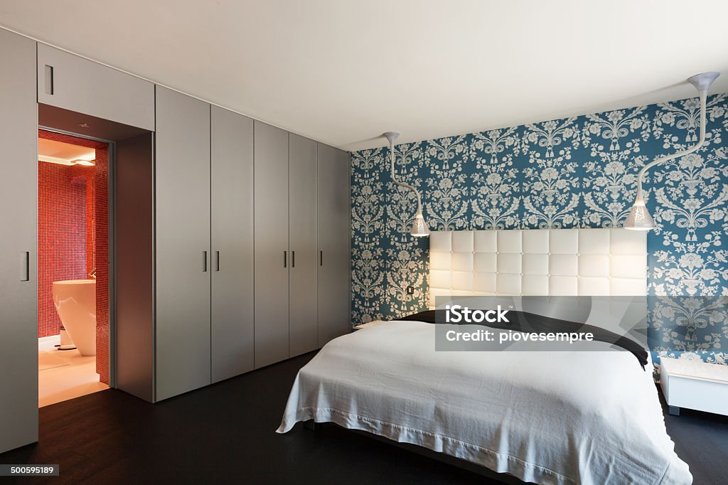 Beautiful bedroom interior of a modern villa, beautiful bedroom with double bed Domestic Bathroom Stock Photo