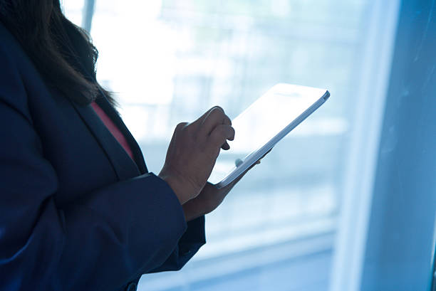 istock Businessman checking business reports on digital tablet 500598134