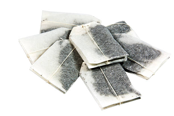 istock Seven Unused Tagged Teabags Placed in a Pile 500598299