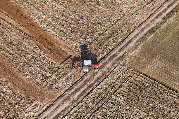 istock aerial view of harvest fields with tractor 500598446
