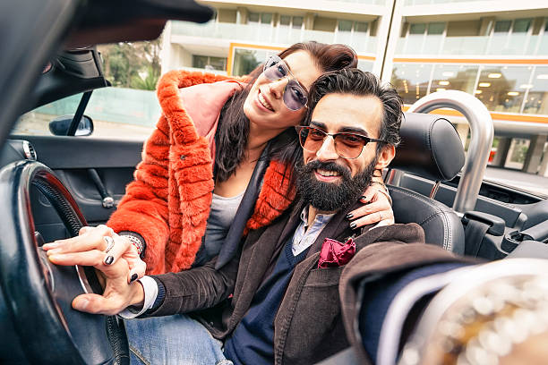 Handsome hipster boyfriend having fun with girlfriend