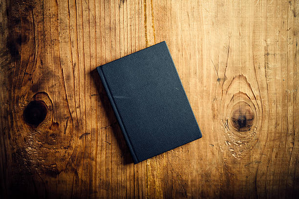 istock Black notebook on wooden office desk 500600866