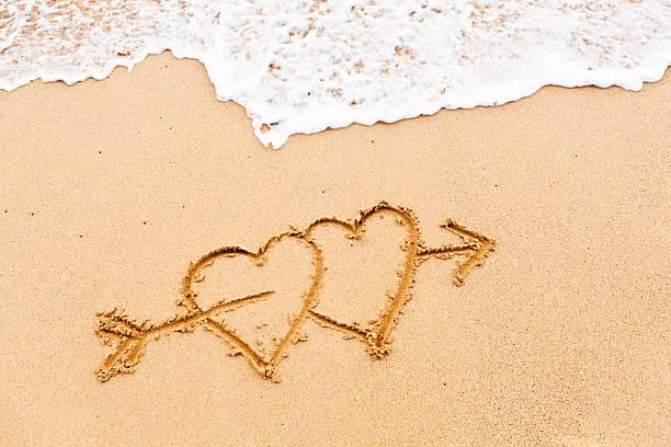Two Love Hearts on Arrow on Tropical Beach