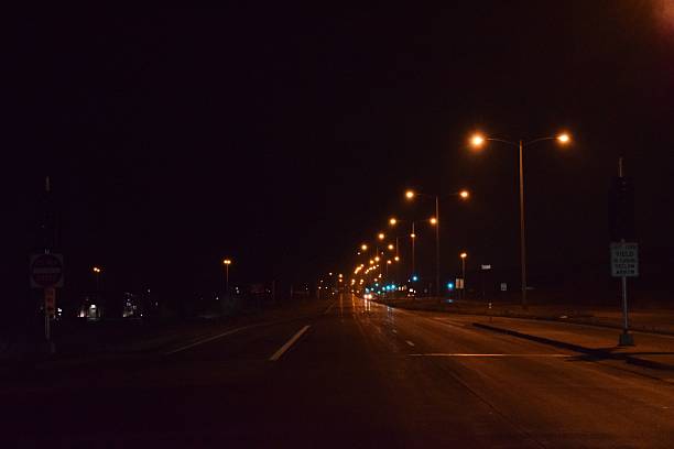istock Street Lights And Empty Streets At Midnight 500602252