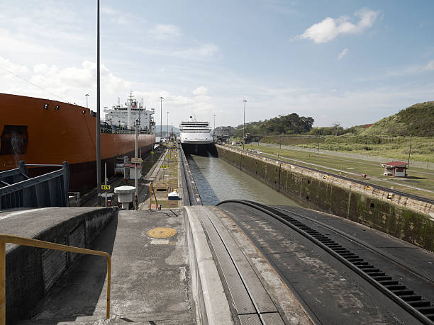 Cargo ship and a Cruise ship at Miraflores Locks, Panama Canal stock photo
