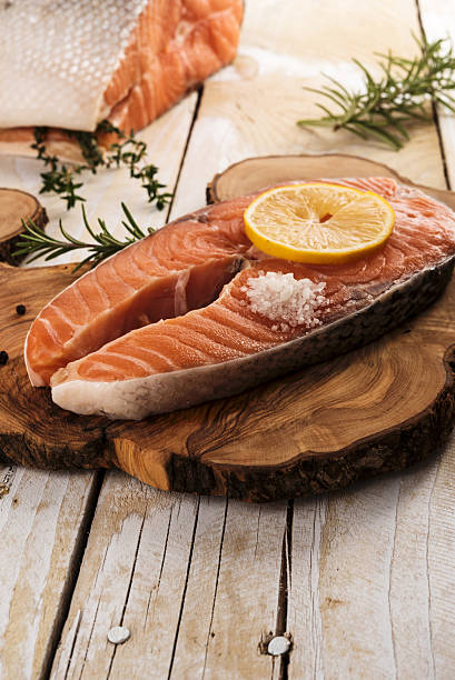 istock Salmon steak on wooden board 500603374