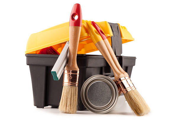 istock Can of paint with paintbrushes and toolbox isolated on white 500603590