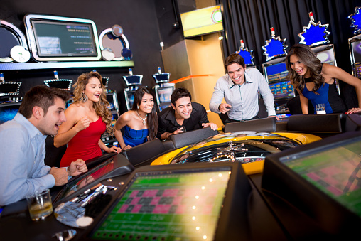 Group of friends at the Casino playing roulette