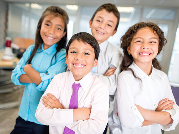 Group of business kids Group of business kids at the office looking happy entrepreneurship kids stock pictures, royalty-free photos & images