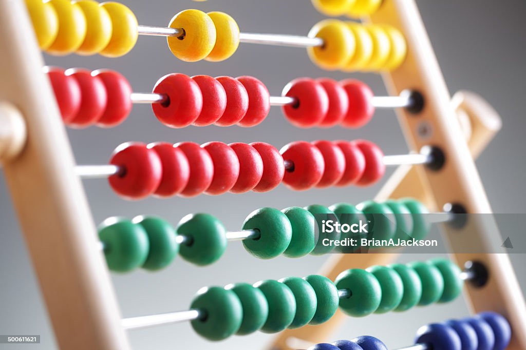 Abacus Abacus close up against gray backround concept for counting, mathematics, education and finance Abacus Stock Photo