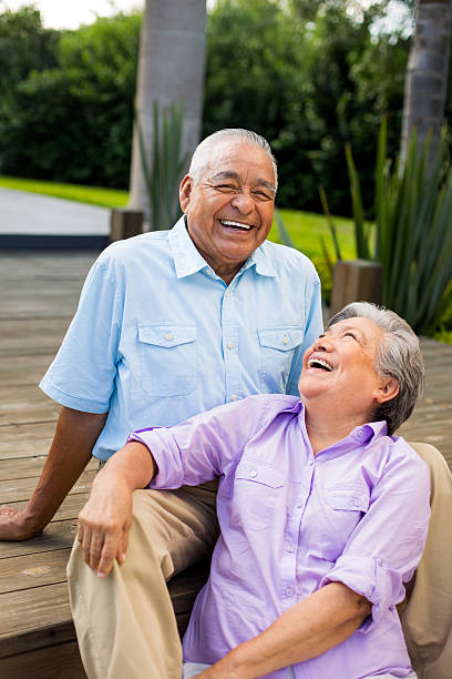 istock Mexican senior couple laughing together 500611983