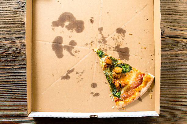 istock One piece of pizza in cardboard pizza box 500612190