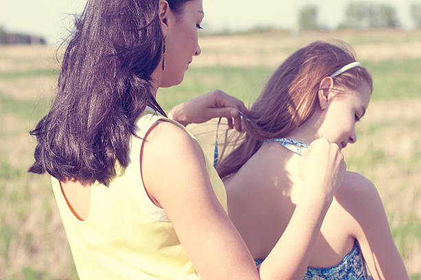 istock Mother dress daughter ties 500613933