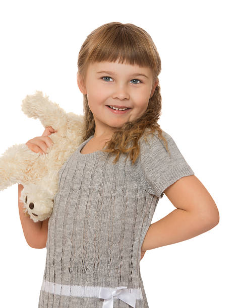 istock little girl with soft toy 500613954