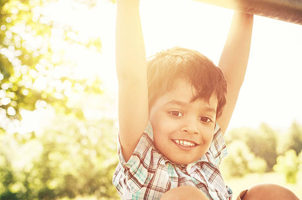 Portrait of a little indian boy outdoors stock photo