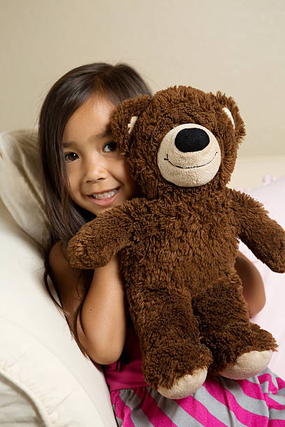 istock Little girl with a teddy bear 500614627
