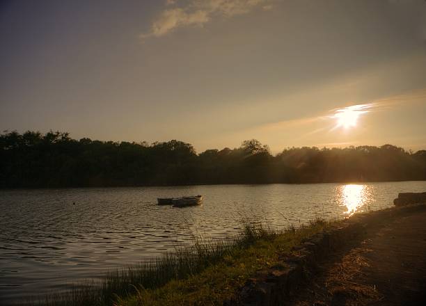 istock two rowing boats on a reservoir at sunset 500614727