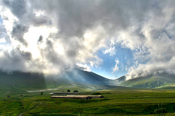 istock cloudy sunrise in the mountains 500615669