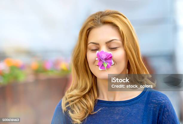 Smelling Flower Stock Photo - Download Image Now - 30-34 Years, Adult, Adults Only