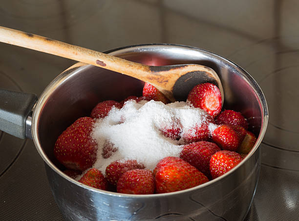istock Strawberry jam cooking encore of sugar 500616855