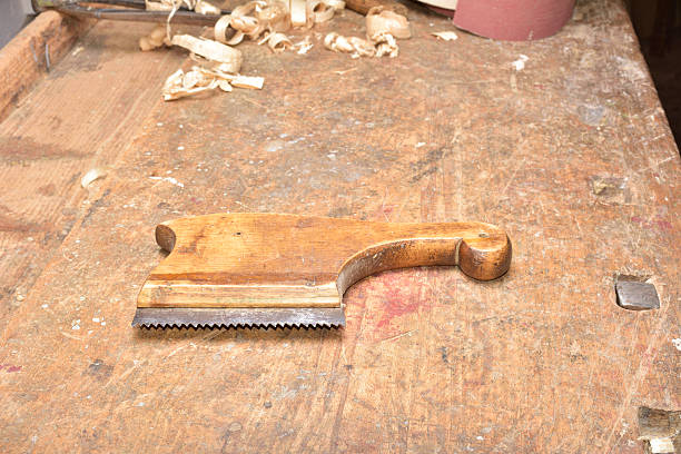 istock carpenter working with plane on wooden 500617282