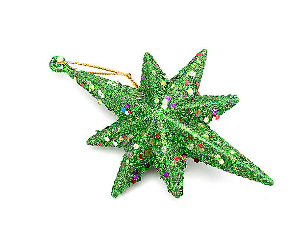 istock Green Christmas star isolated on white background 500618194