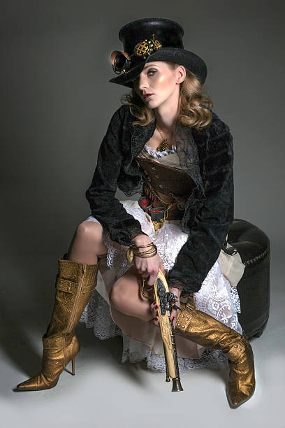SteamPunk Beauty A beautiful young woman in Steampunk attire sitting. steampunk pistol pictures stock pictures, royalty-free photos & images