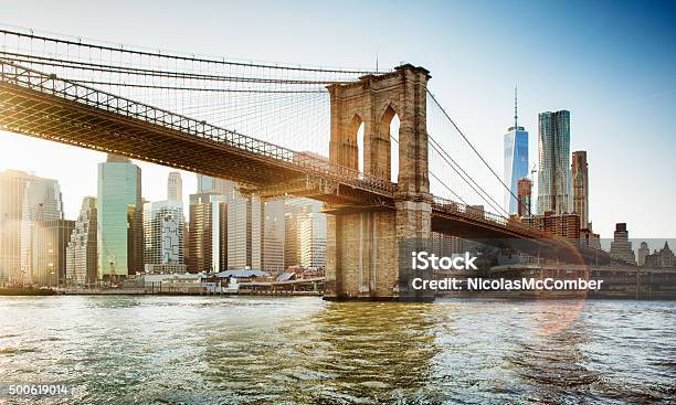Brooklyn Bridge From East River Sunset With Flare Stock Photo - Download Image Now - New York City, Brooklyn Bridge, Bridge - Built Structure