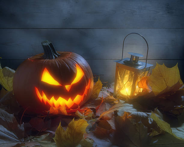 istock Nightmarish jack o lantern by wooden wall 500621934
