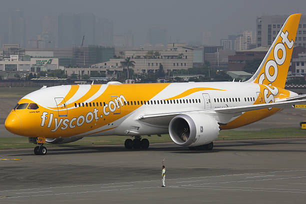 dem scoot boeing 787 dreamliner flugzeug - scoot stock-fotos und bilder