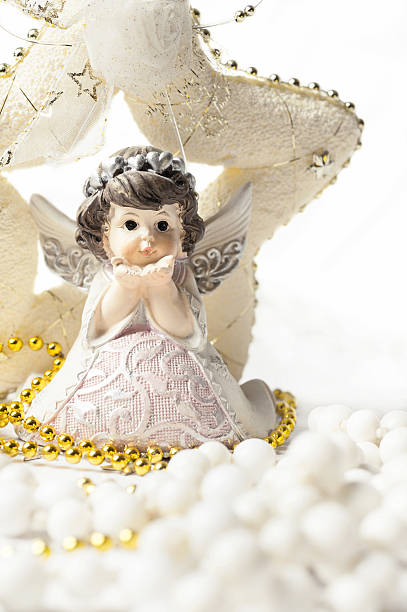 istock christmas angel with star at white background 500622956