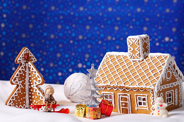 istock Christmas card with gingerbread house and tree 500624446