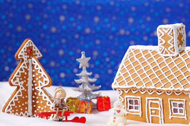 istock Christmas card with gingerbread house and tree 500624462