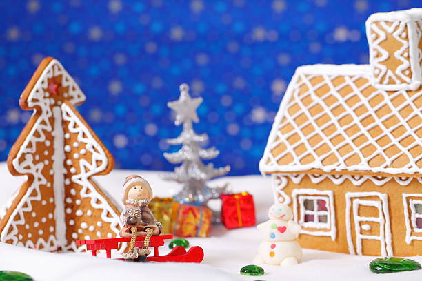istock Christmas card with gingerbread house and tree 500624470