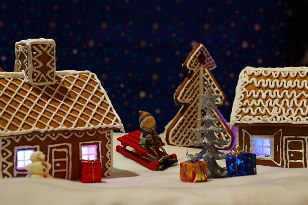 istock Christmas card with gingerbread house and tree 500624574