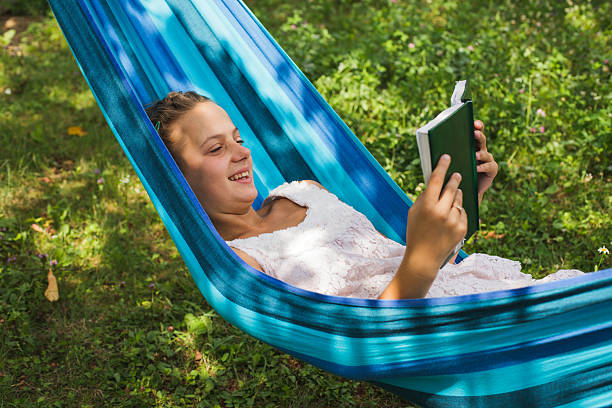 istock Relax with a book in the green garden 500624972
