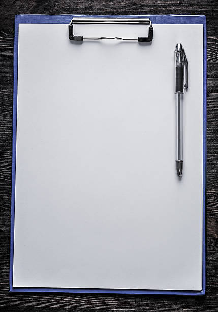istock Clean notepad and pen on wood board office concept 500627146